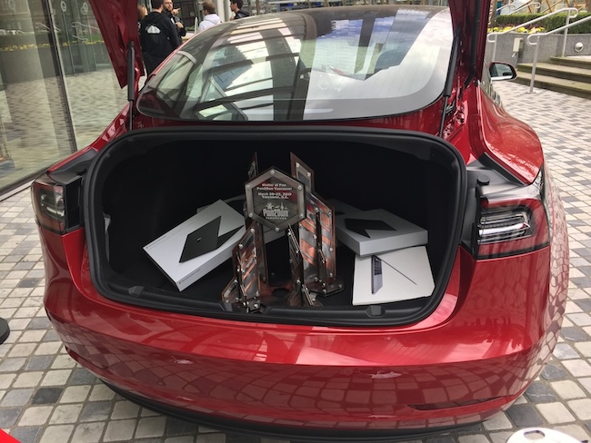 Призы команды Fluoroacetate в багажнике Tesla Model 3 на Pwn2Own 2019